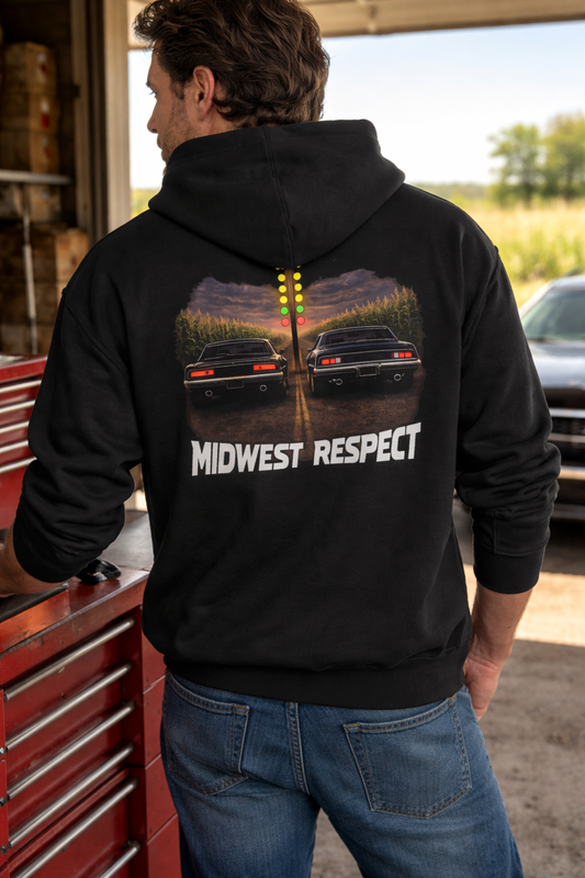 Person wearing a black hoodie with 'Midwest Respect' graphic, standing in a garage.