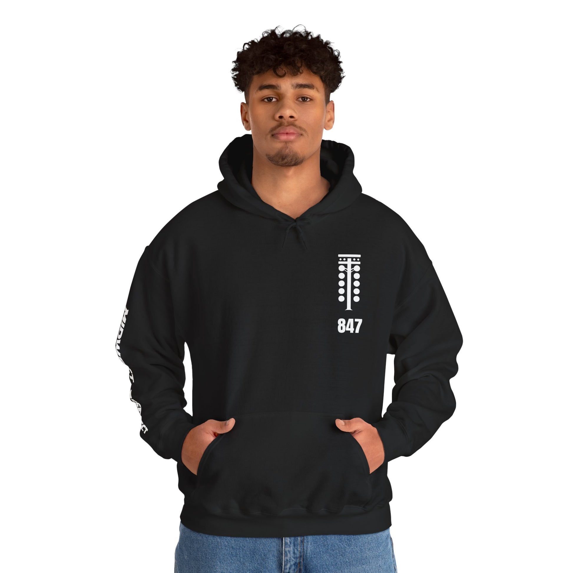 Person wearing a black hoodie with a logo and text on a white background