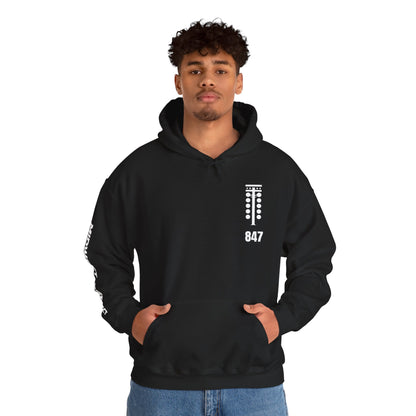Person wearing a black hoodie with a logo and text on a white background