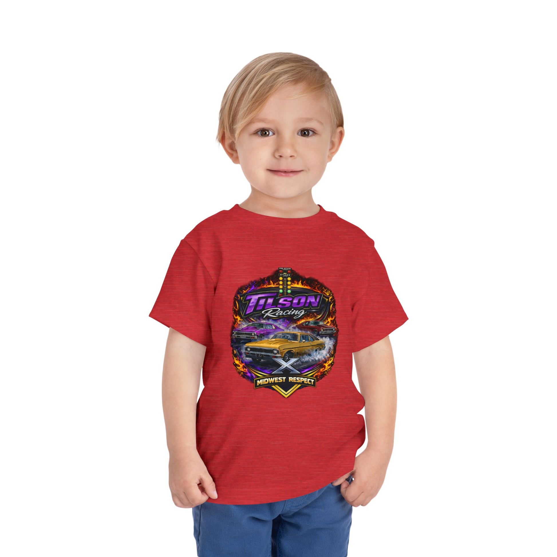 Child wearing a red t-shirt with a graphic design on a white background