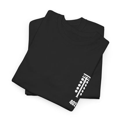 Folded black t-shirt with white graphic design on a white background
