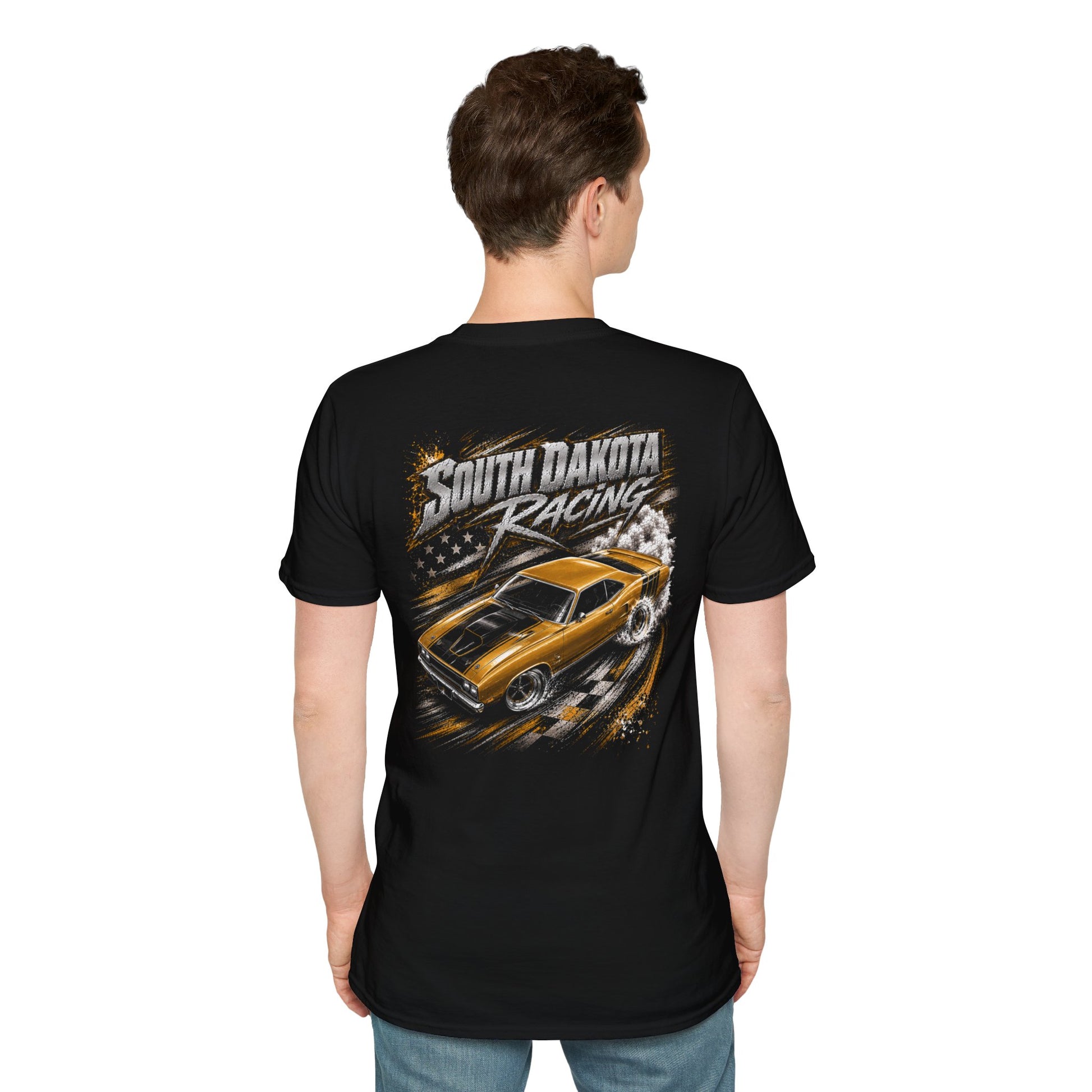 A man viewed from the back wearing a black short-sleeve t-shirt with a large graphic print on the back. The graphic features the text 'South Dakota Racing' above an illustration of a yellow and black muscle car drifting, with smoke and a checkered flag motif.