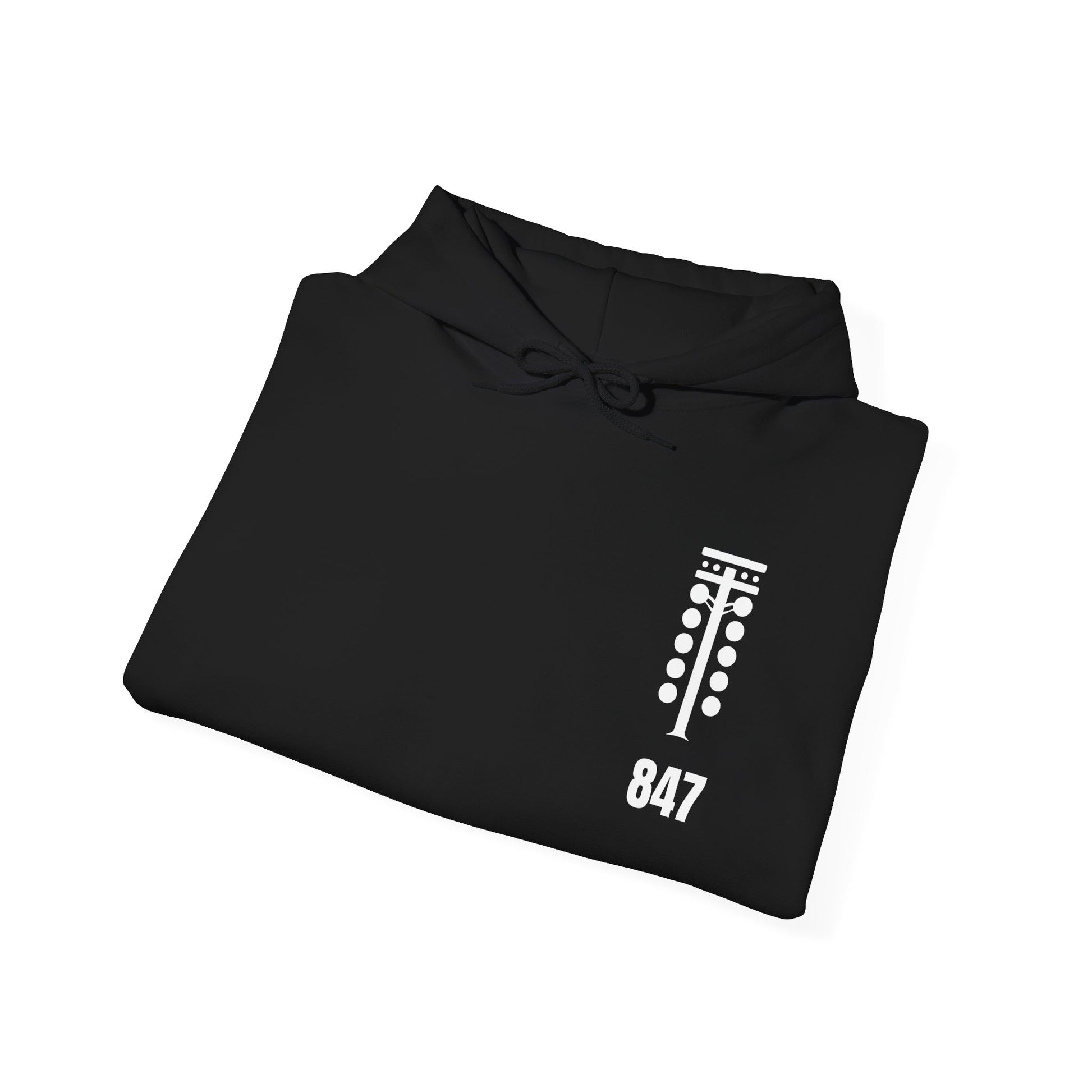 Folded black hoodie with white graphic design on a white background