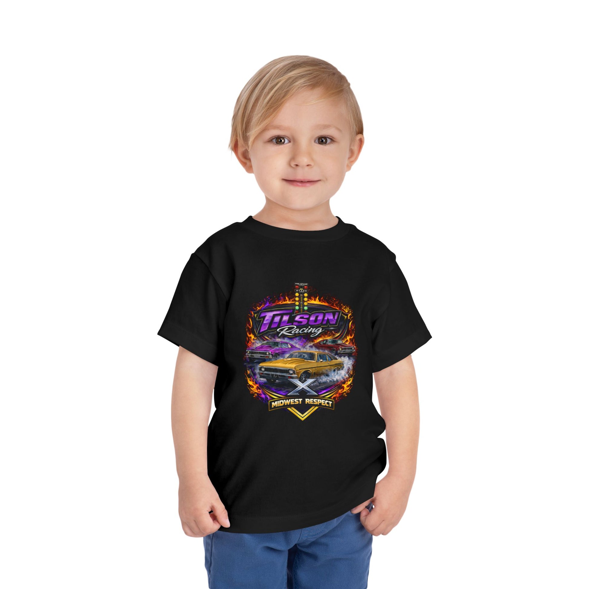 Child wearing a black t-shirt with a colorful graphic design on a white background