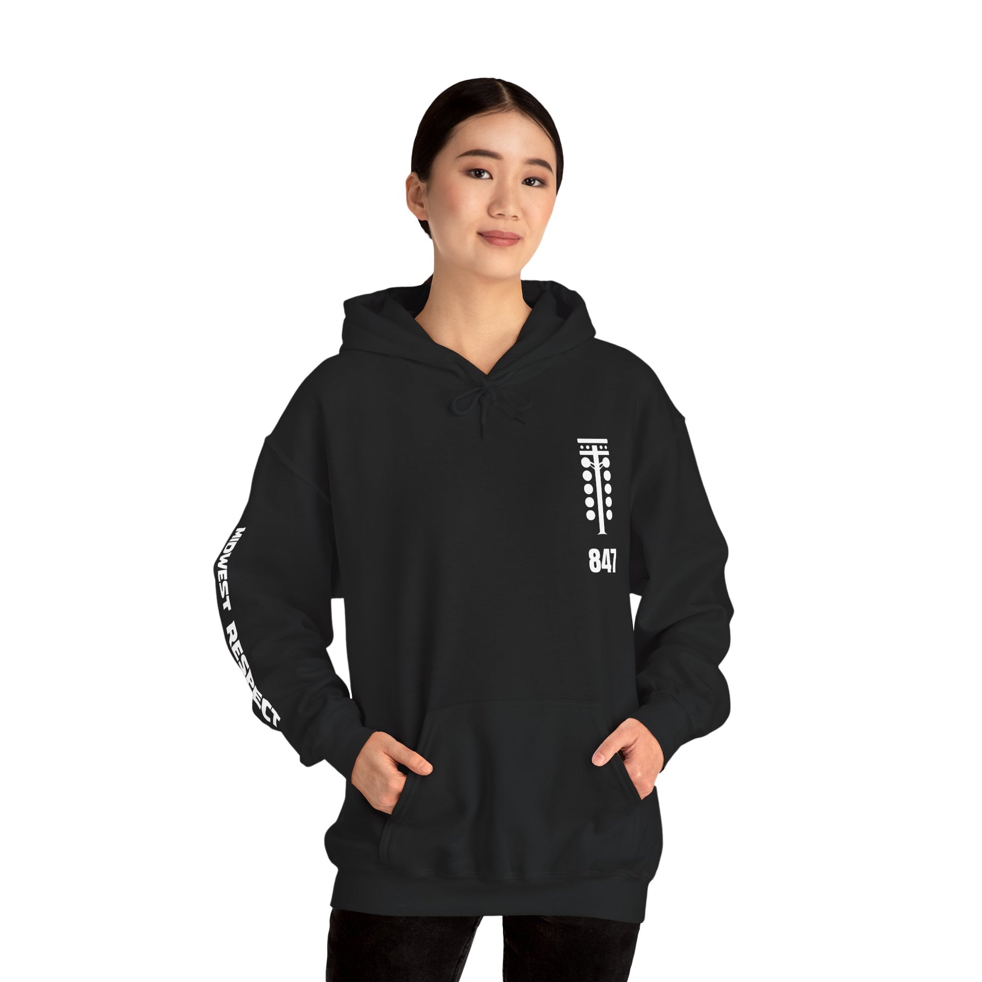 Person wearing a black hoodie with white text on a white background
