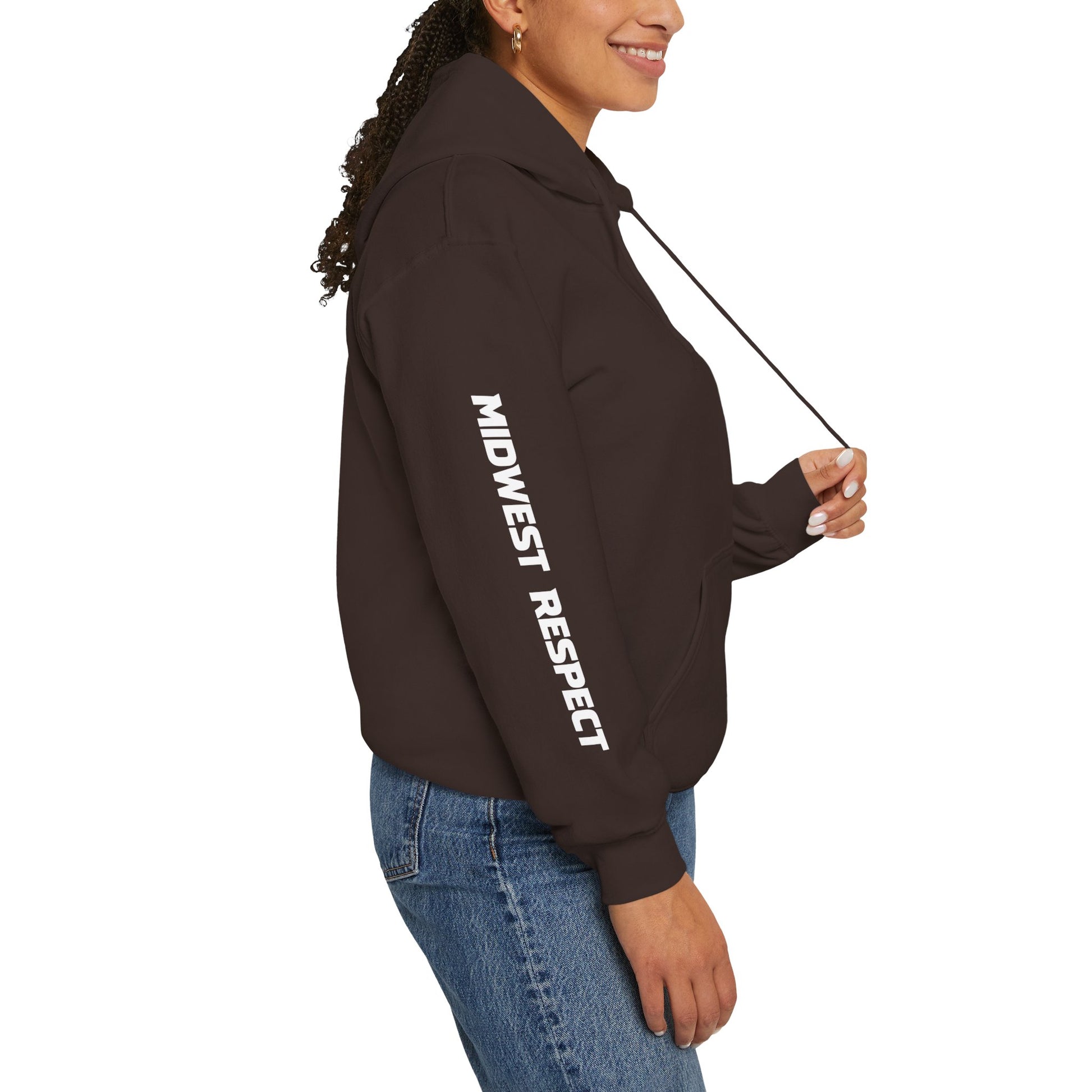 Person wearing a brown hoodie with  graphics on sleeves against a white background