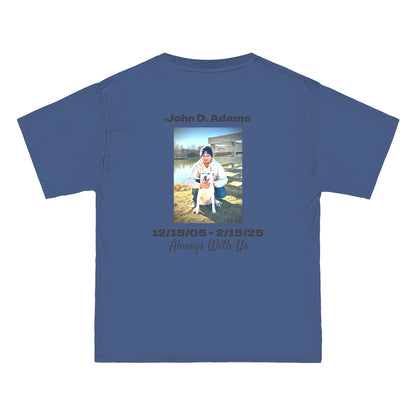 Blue t-shirt with a photo and text of a person and dog, along with dates and name on a white background.