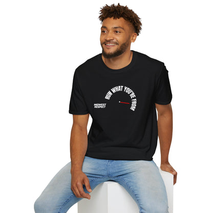 Man wearing a black t-shirt with text and graphics, sitting on a white stool against a white background.