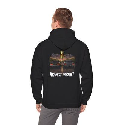 Person wearing a black hoodie with racing image on the back
