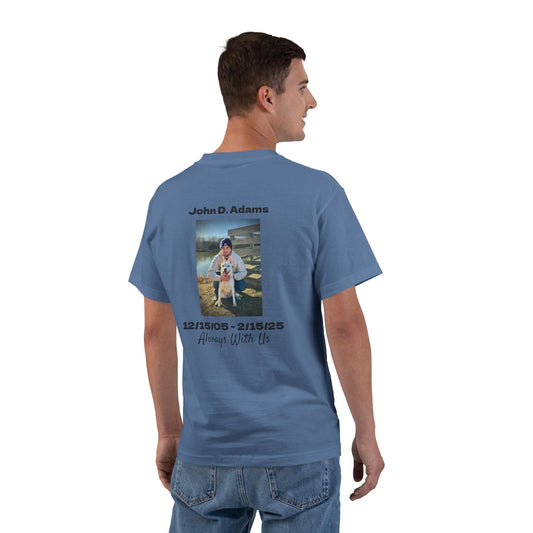 Man wearing a blue t-shirt with a photo and text on the back, standing against a white background