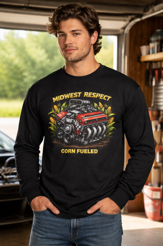 Man wearing a black long-sleeve shirt with a graphic design in a garage setting