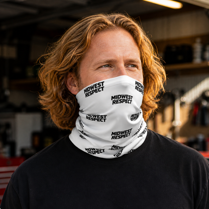 Person wearing a white neck gaiter with 'Midwest Respect' text in a blurred indoor setting