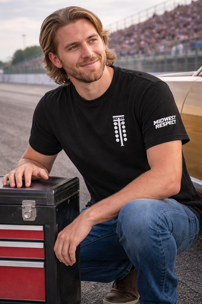 Man wearing a black t-shirt with 'Midwest Respect' logo sitting next to a toolbox.