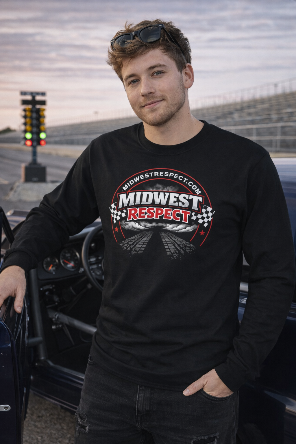 Man wearing a black sweatshirt with 'Midwest Respect' logo on a race track background