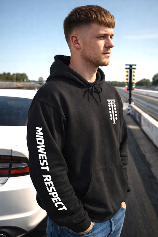 Man wearing a black hoodie with 'Midwest Respect' text on a road background